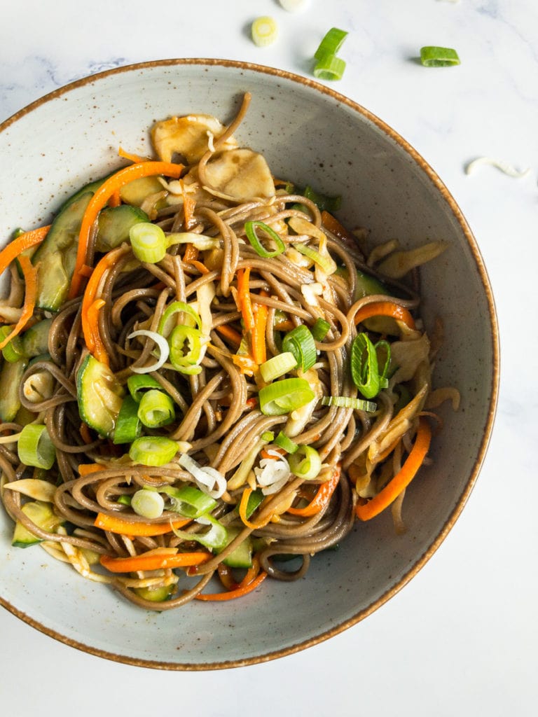 cold soba noodle salad with ginger-soy-dressing in a bowl