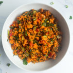 kisir turkish bulgur salad in a white bowl with parsley on the table