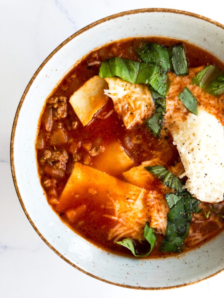 easy lasagna soup with fresh basil in a bowl