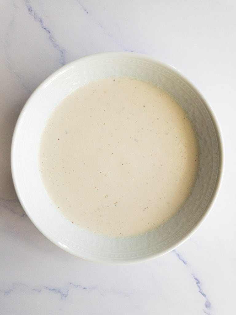 vegan cashew Alfredo sauce in a white bowl