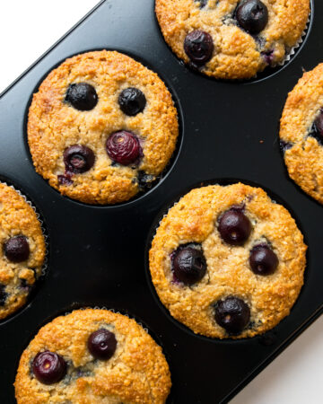 almond flour blueberry muffins in a muffin tin