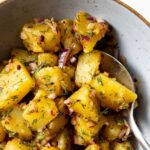 Turkish dill potato salad in a bowl with a spoon