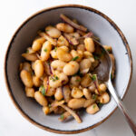 Turkish white bean salad in a bowl with a spoon