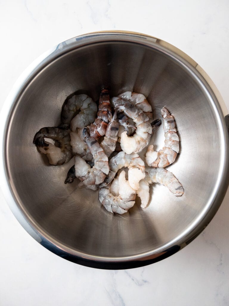 raw shrimp in a large mixing bowl