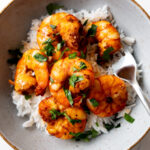 air fryer shrimp in a bowl with a fork