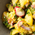 herbed mustard potato salad in a bowl