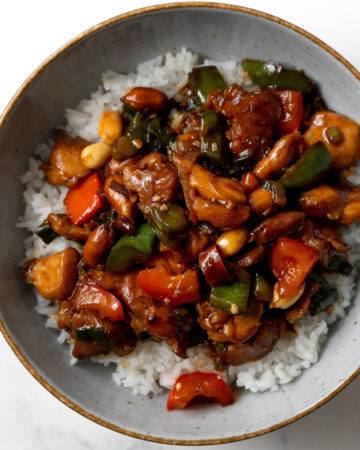 kung pao chicken served over rice in a bowl
