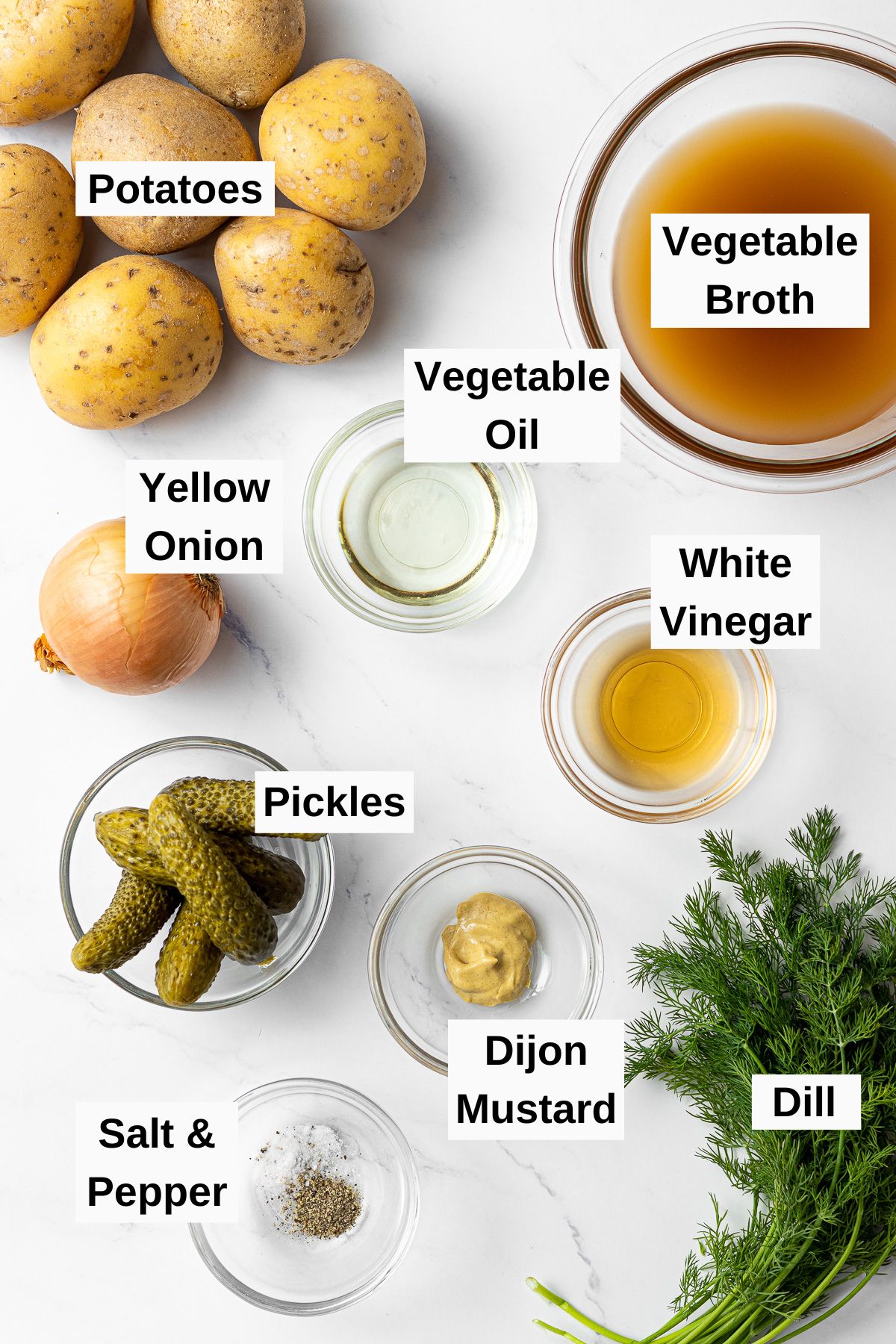 ingredients for dill pickle potato salad on a table