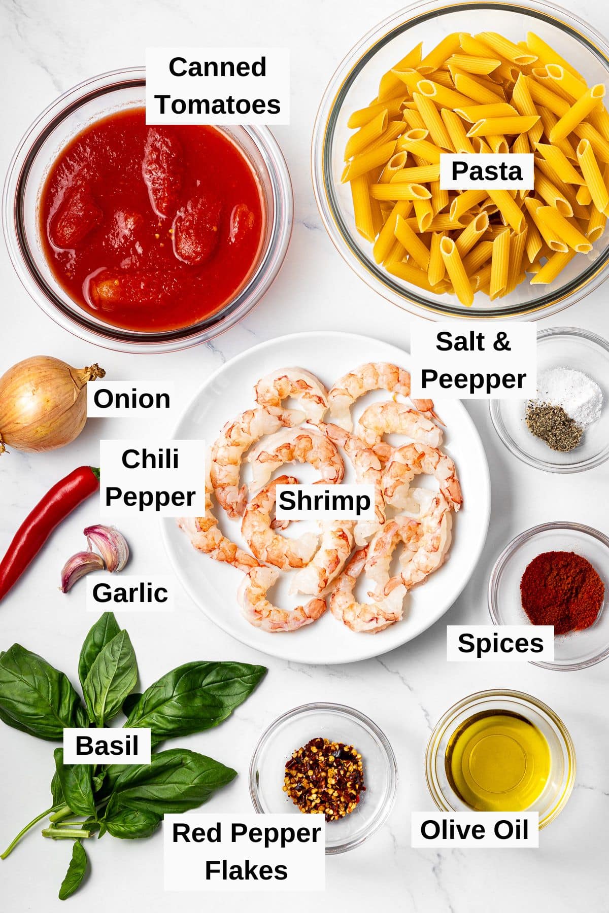 all ingredients for shrimp arrabbiata on a table