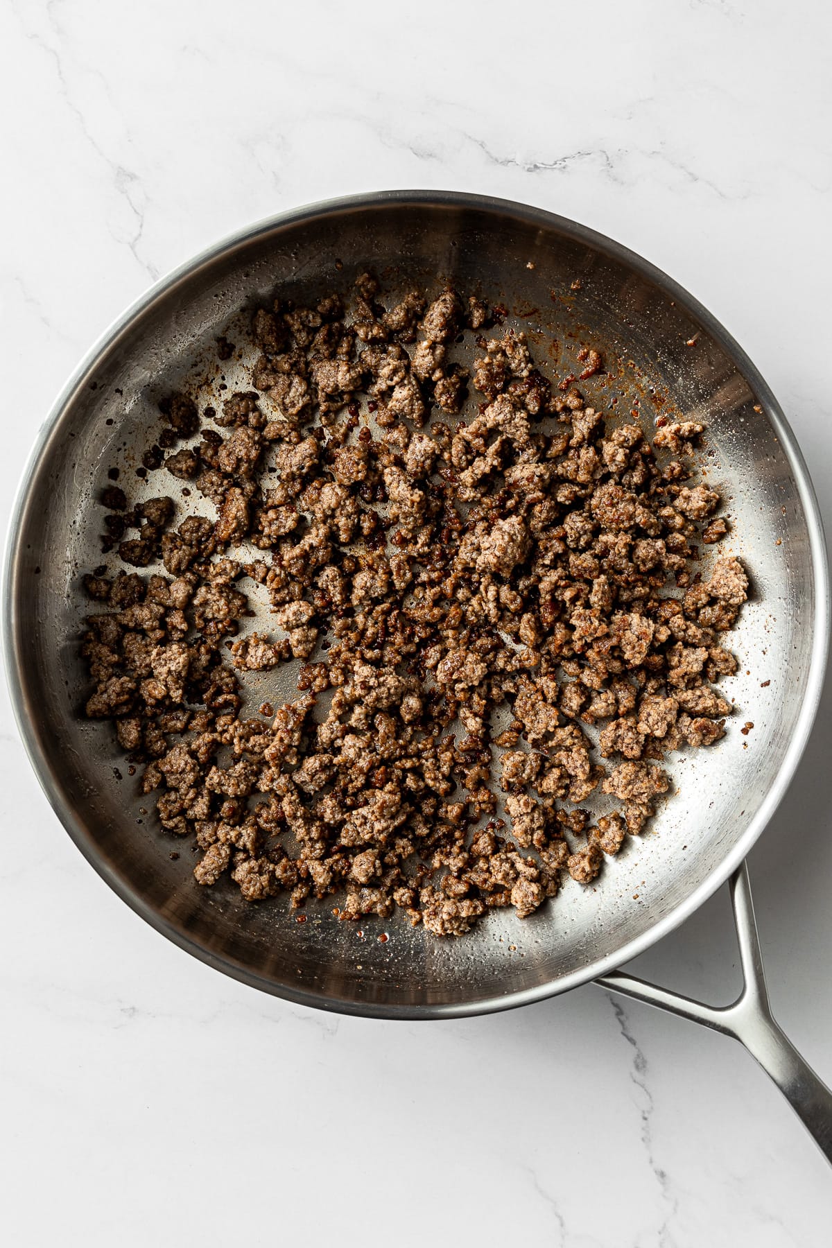 cooked ground beef in a pan