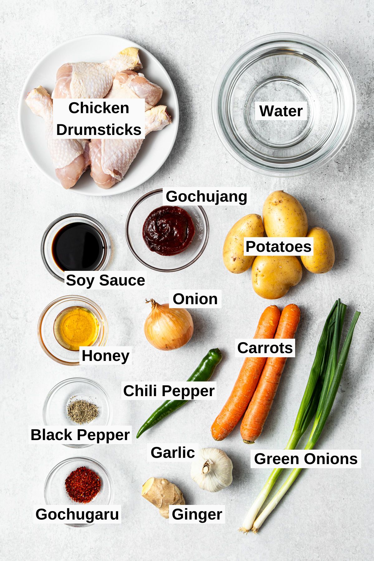 all ingredients for dakbokkeumtang (spicy Korean chicken stew) on a table