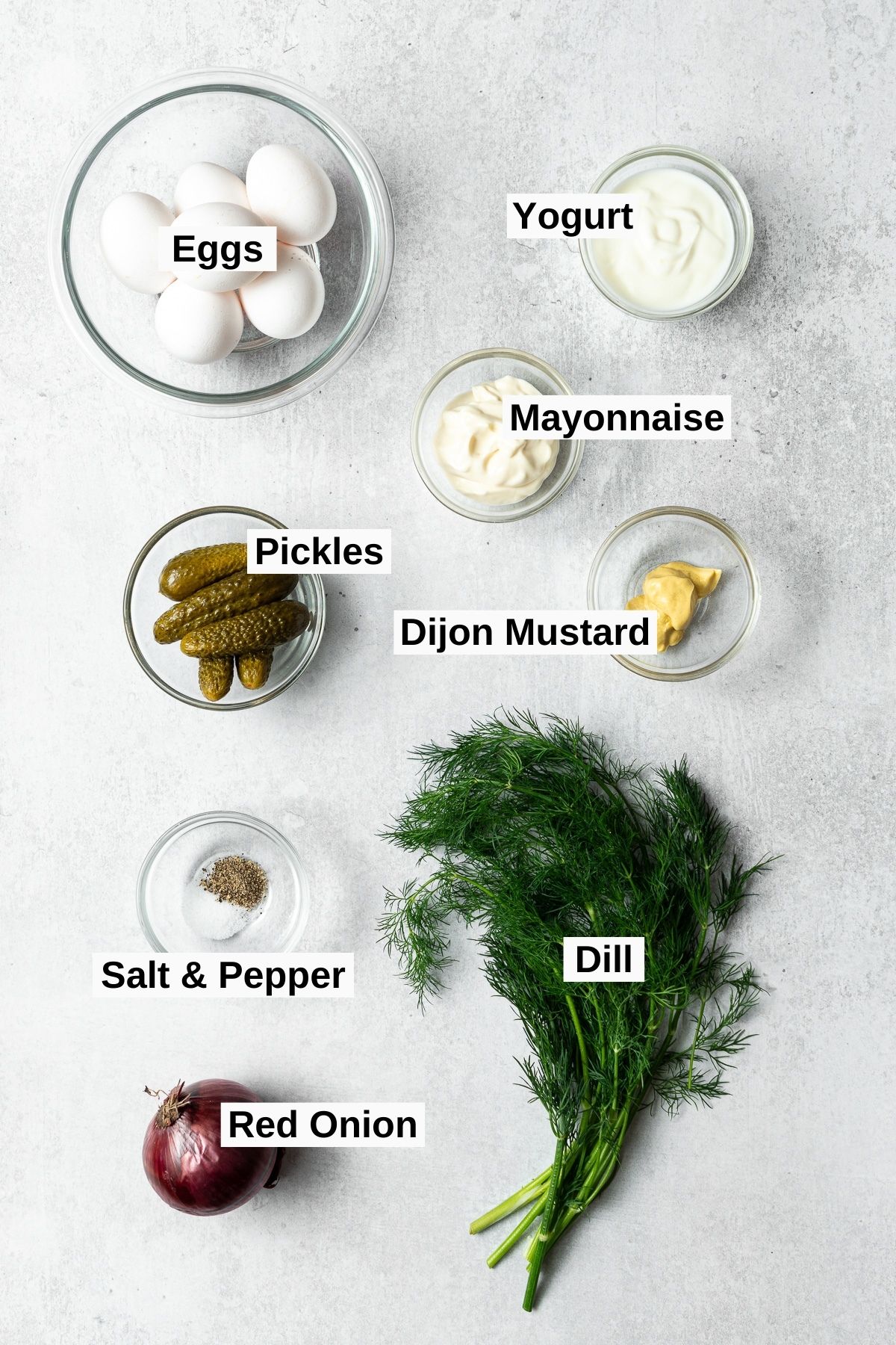 all ingredients for dill pickle egg salad on a table