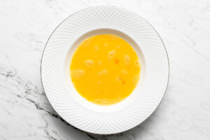 beaten eggs in a shallow plate