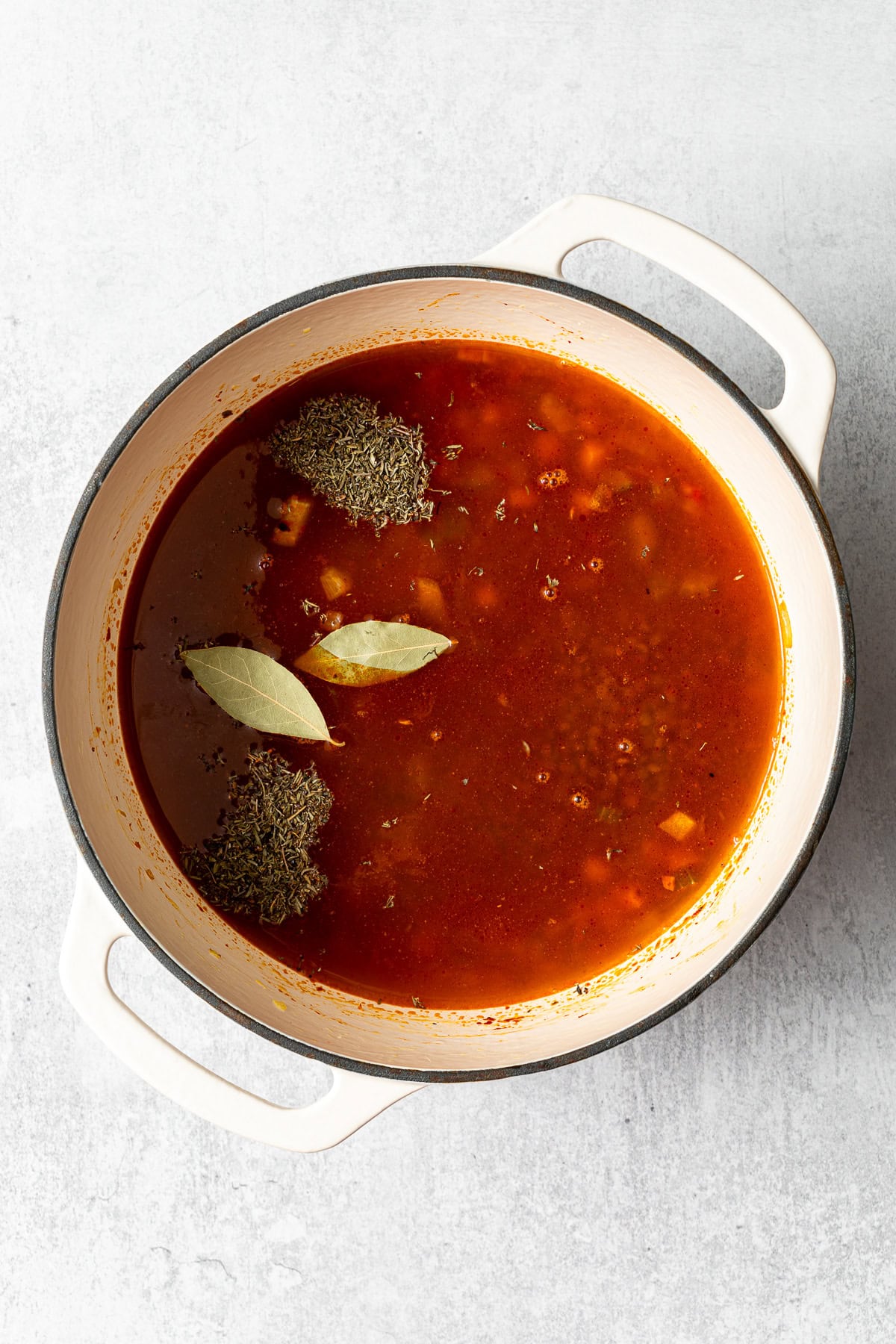 all the ingredients for tomato lentil soup in a pot