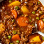 hamburger stew in a bowl with a spoon